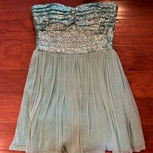 Strapless prom dress. Light aqua green. Sequenced bodice. 2 layer lining.